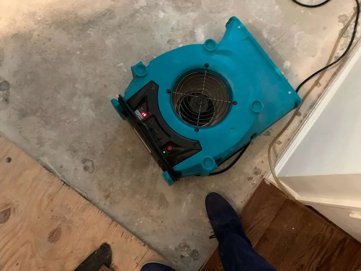 Air mover drying subfloor during Commercial Water Damage Restoration in Galena Park